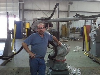 Joe E. Crowl Jr. CWI, CWE pictured during install of SRT’s first robot sale September 2008.